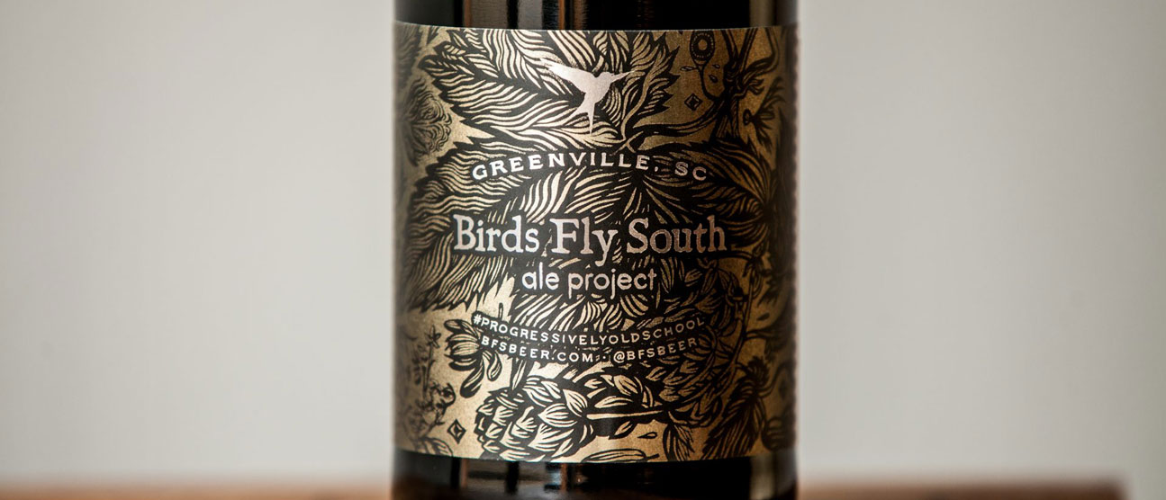 Intricately designed metallic label for Birds Fly South Ale Project