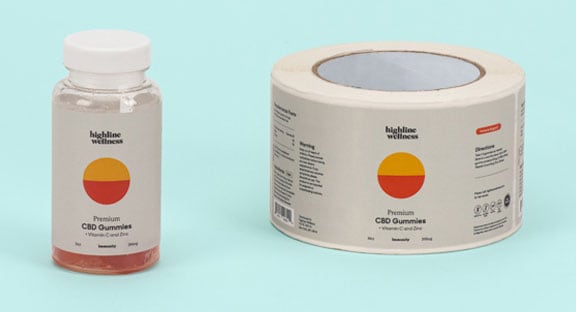 Highline Wellness CBD Gummies next to a roll of their corresponding labels.
