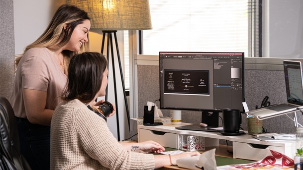 Frontier Label employees reviewing a product label design.