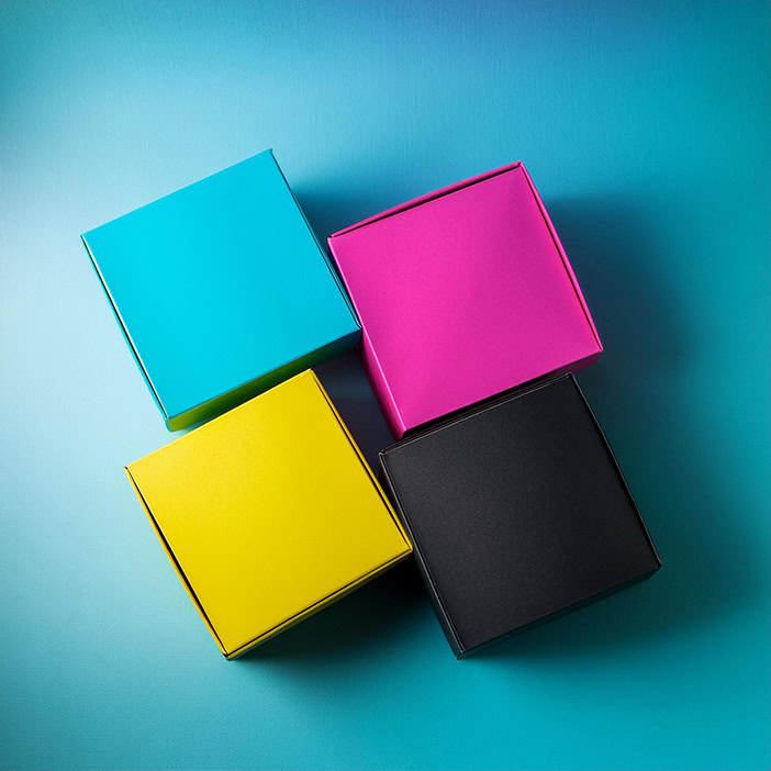 folding product boxes in cyan magenta yellow and black top view of folding carton boxes